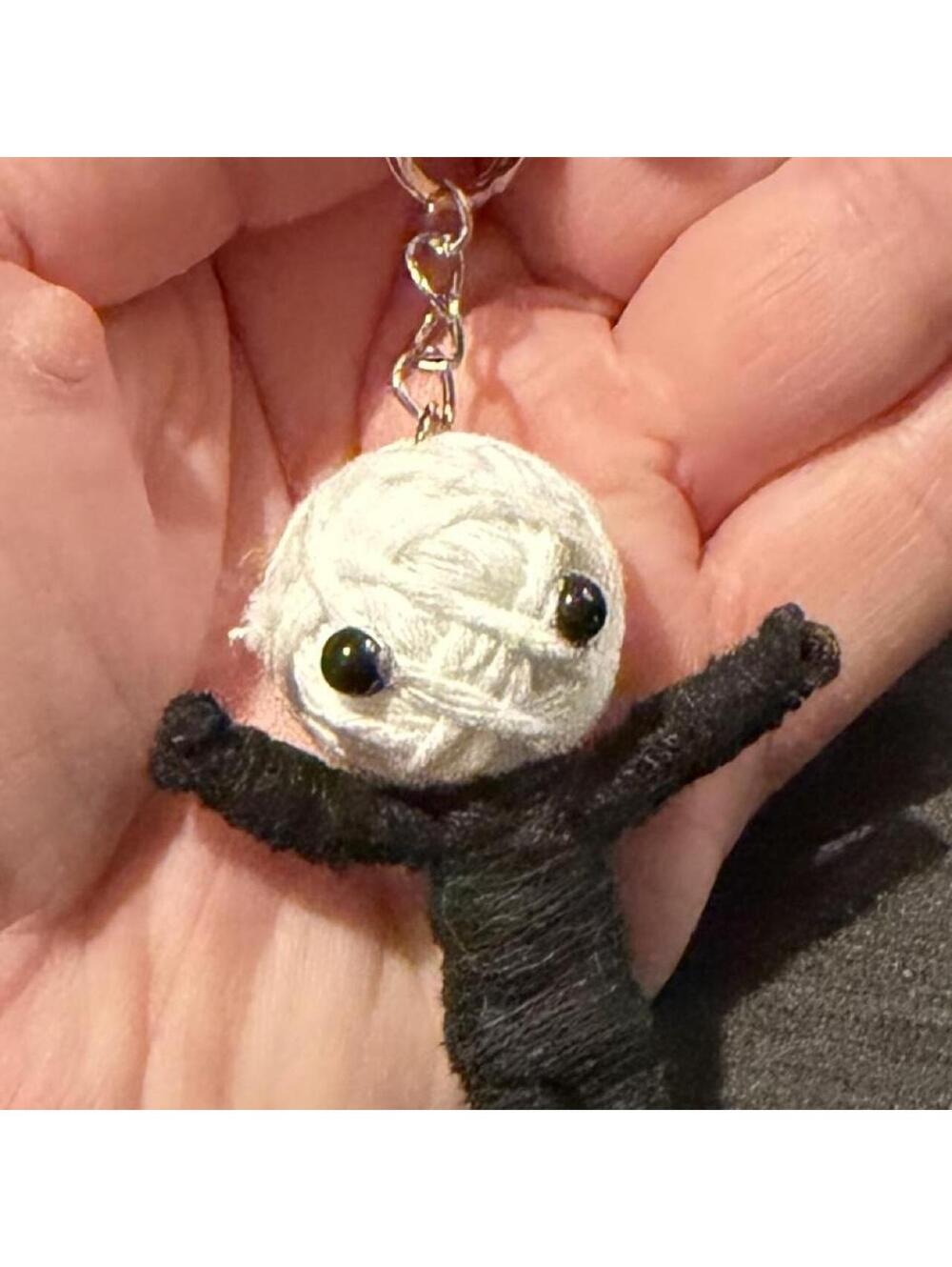 Cute little yarn voodoo keychain. Black & white yarn doll keychain.
